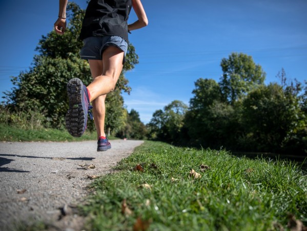 person running through a park person running through a park