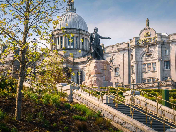 Statue at Aberdeen's Union Terrace Gardens with His Majesty's Theatre in the background Statue at Aberdeen's Union Terrace Gardens with His Majesty's Theatre in the background