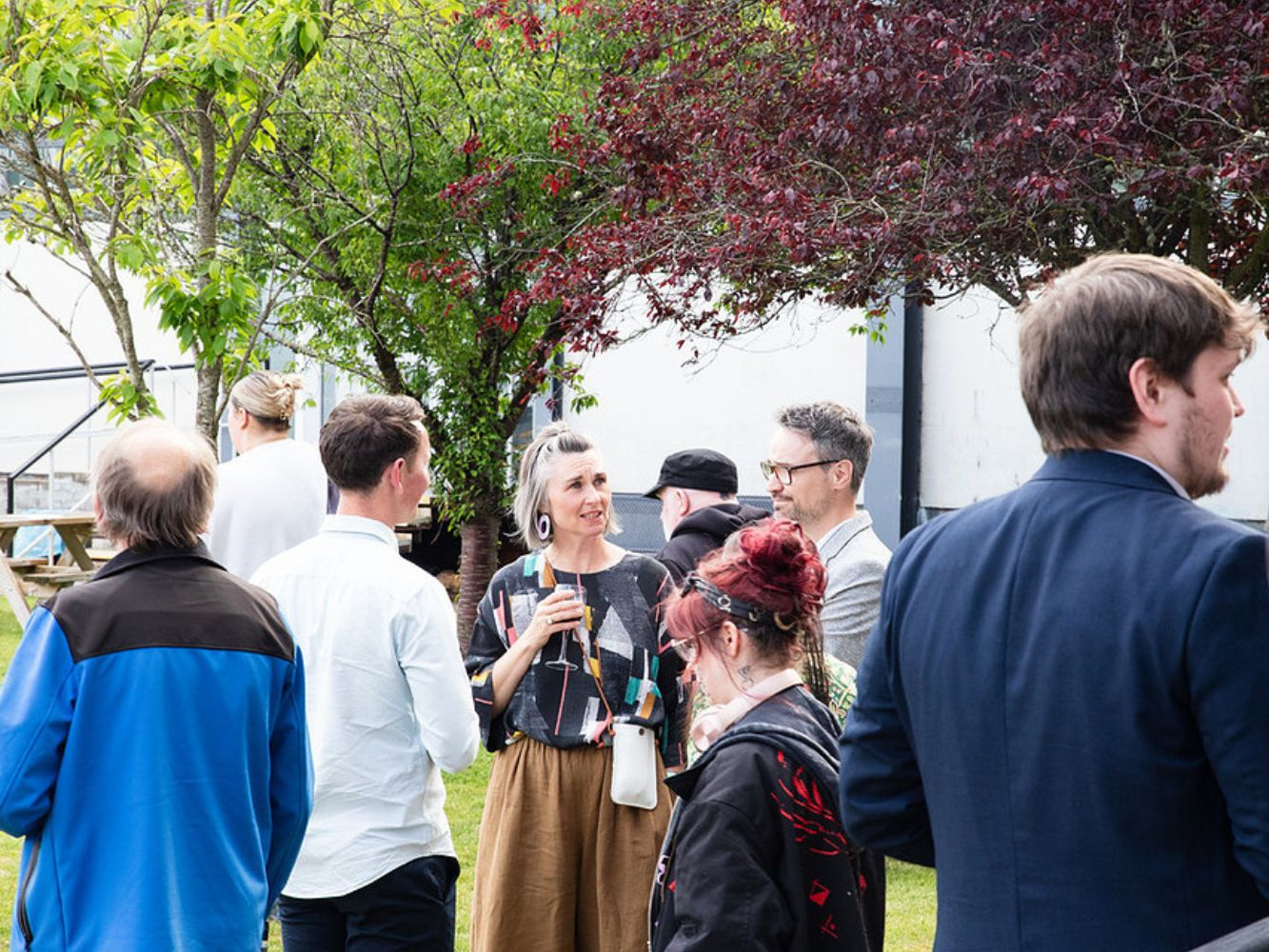 people chatting outside gray's school of art